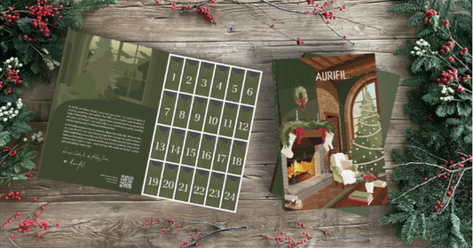 Aurifil Il Salotto 2026 Advent Calendar open box showing numbered grid of 24 doors alongside festive illustrated cover featuring a cosy fireside living room scene, surrounded by winter foliage on a wooden surface