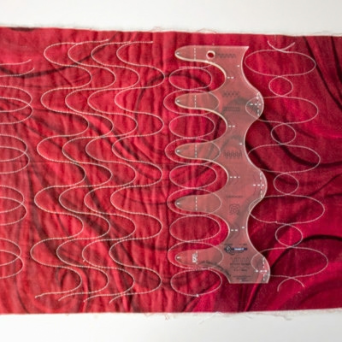 Quilter's Rule Squiggle Tool 3 quilting template red sample