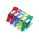 Five colourful mini wonder clips in red, purple, blue, yellow, and green on a white background.