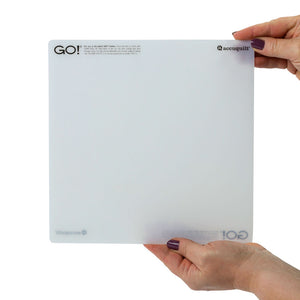 Person holding a clear acrylic sheet with 'GO!' branding on a white background