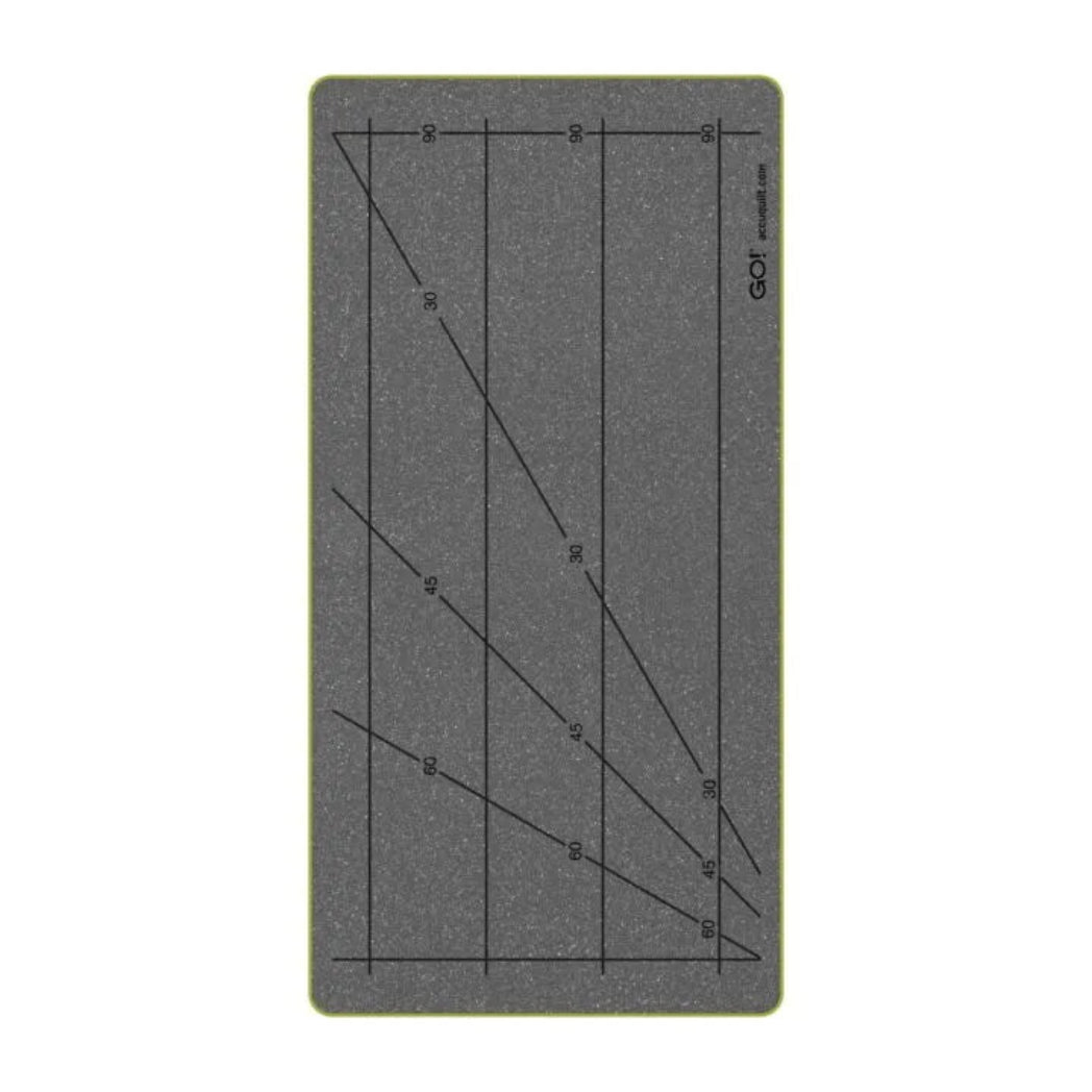 AccuQuilt GO! Small Strip Cutter die plate showing three strip sections with printed angled guide lines at 30°, 45°, and 60° on grey foam surface with lime green border