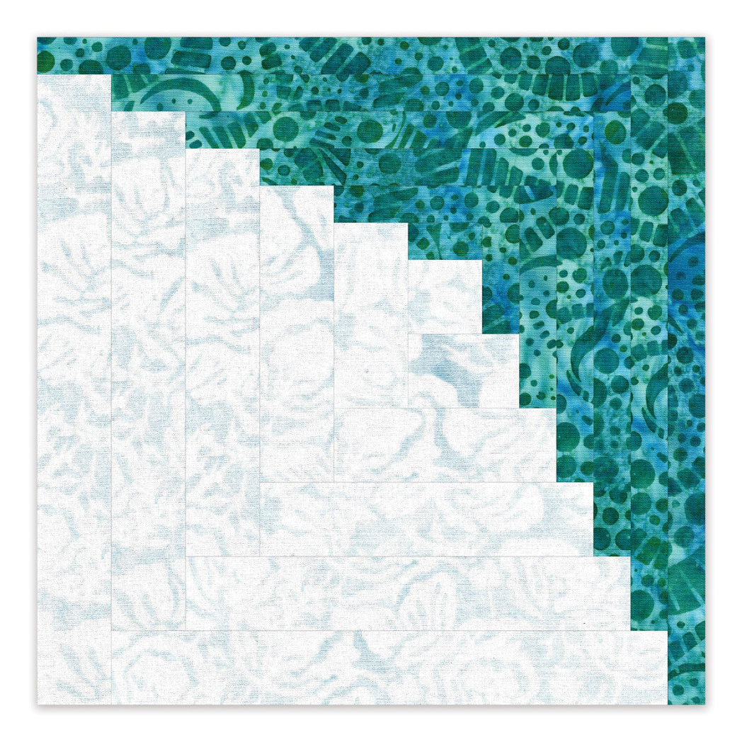 AccuQuilt GO! Curved Log Cabin 9" Block On Board Die - single curved log cabin block in teal batik and white fabric showing stepped curved piecing