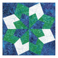 AccuQuilt GO! Double Star 10" finished quilt block sample in blue, green and white batik fabrics, showing the completed double star design with intricate paisley and swirl print details