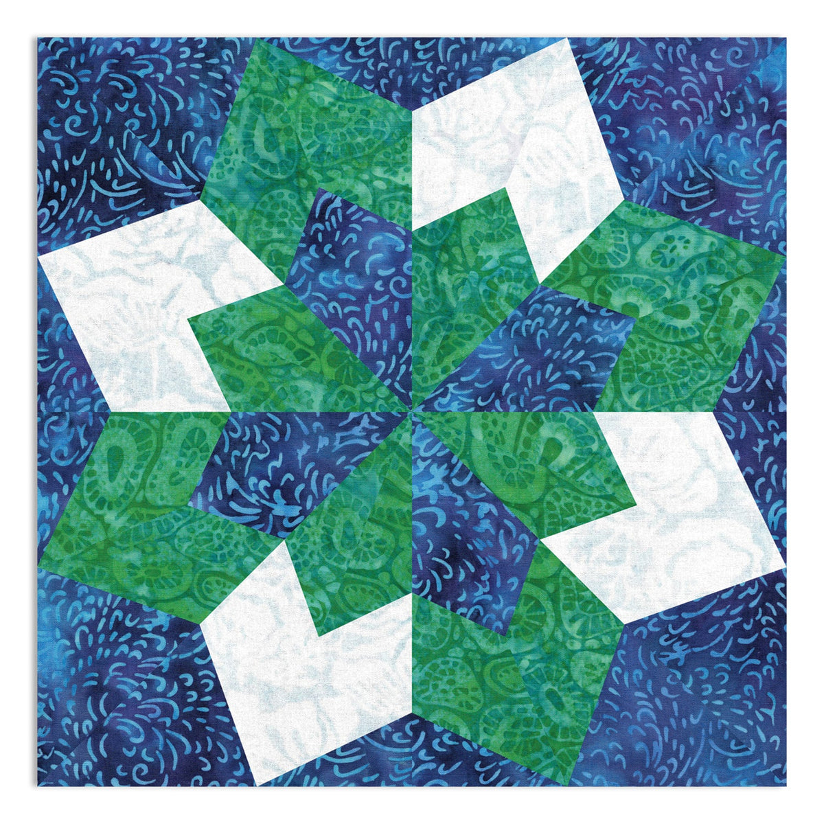 AccuQuilt GO! Double Star 10" finished quilt block sample in blue, green and white batik fabrics, showing the completed double star design with intricate paisley and swirl print details