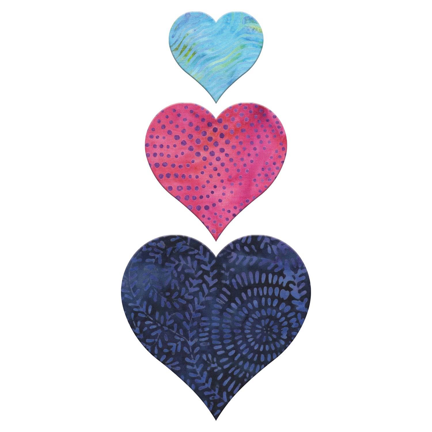 AccuQuilt GO! Heart fabric shapes in light blue swirl, pink dotted and navy batik prints