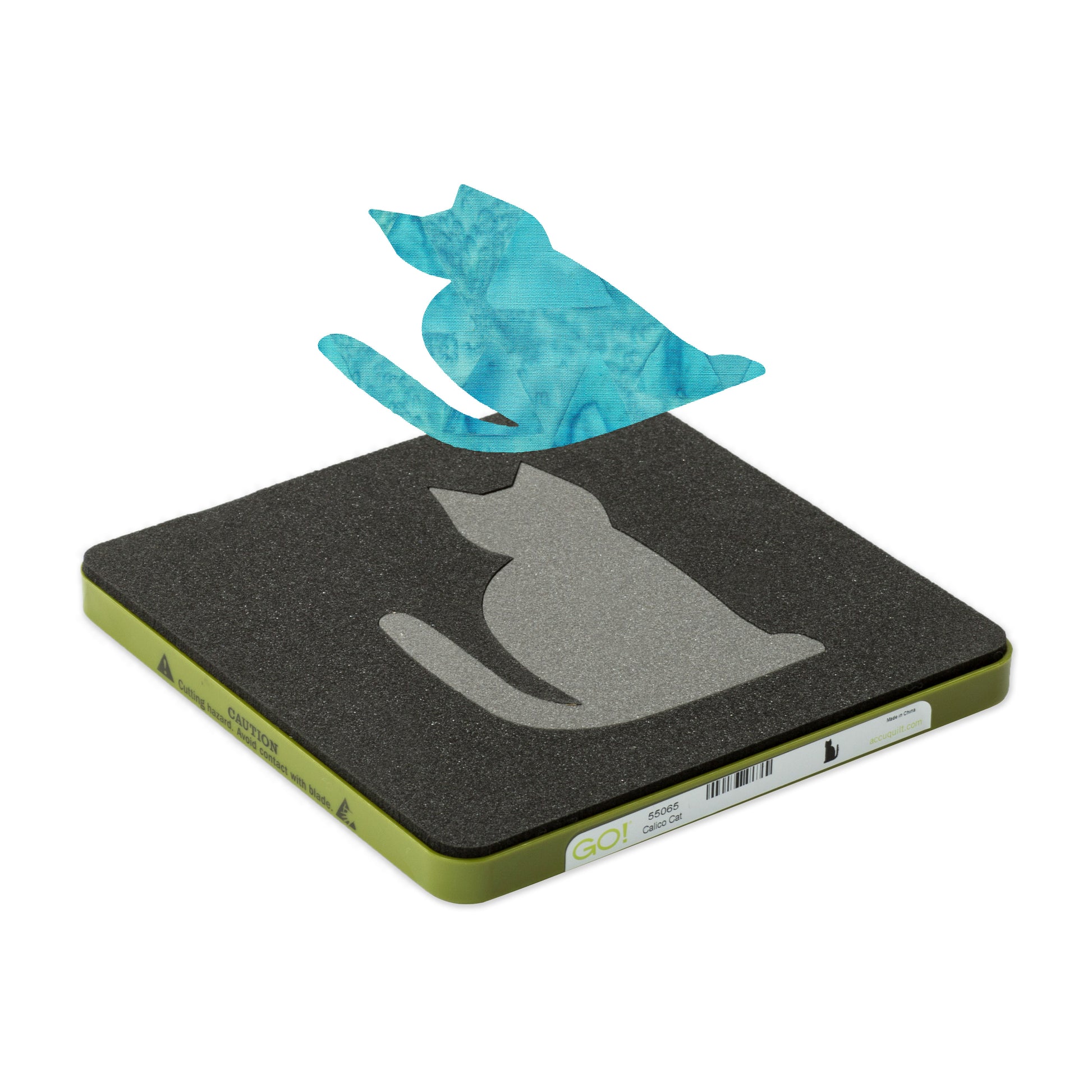 AccuQuilt GO! Calico Cat die at an angle with a turquoise batik cat shape cut and lifted above it