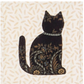 AccuQuilt GO! Calico Cat appliqued in black floral fabric with a beaded collar on cream wheat print
