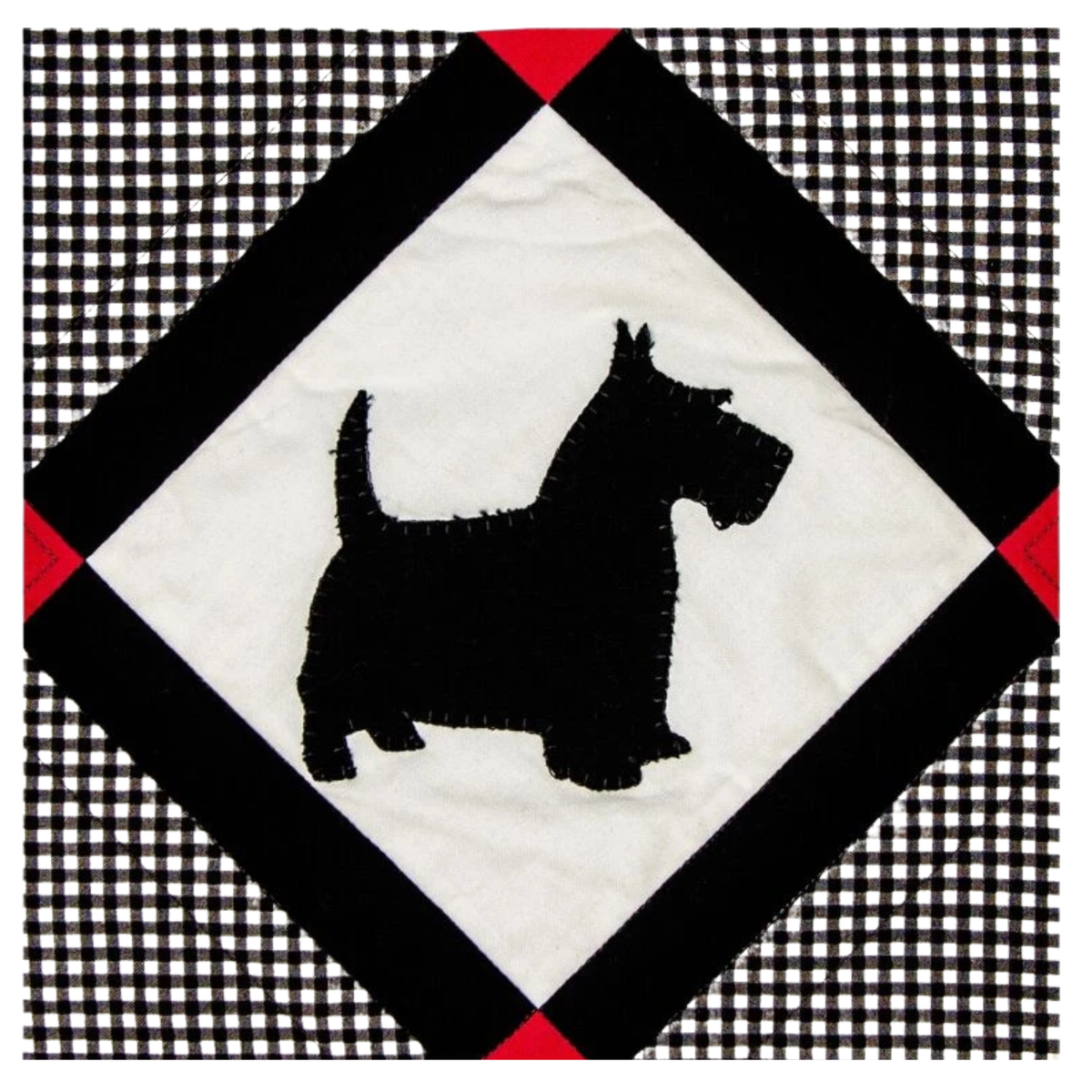 AccuQuilt GO! Scottie Dog appliqued in black on a white diamond with a red and gingham border