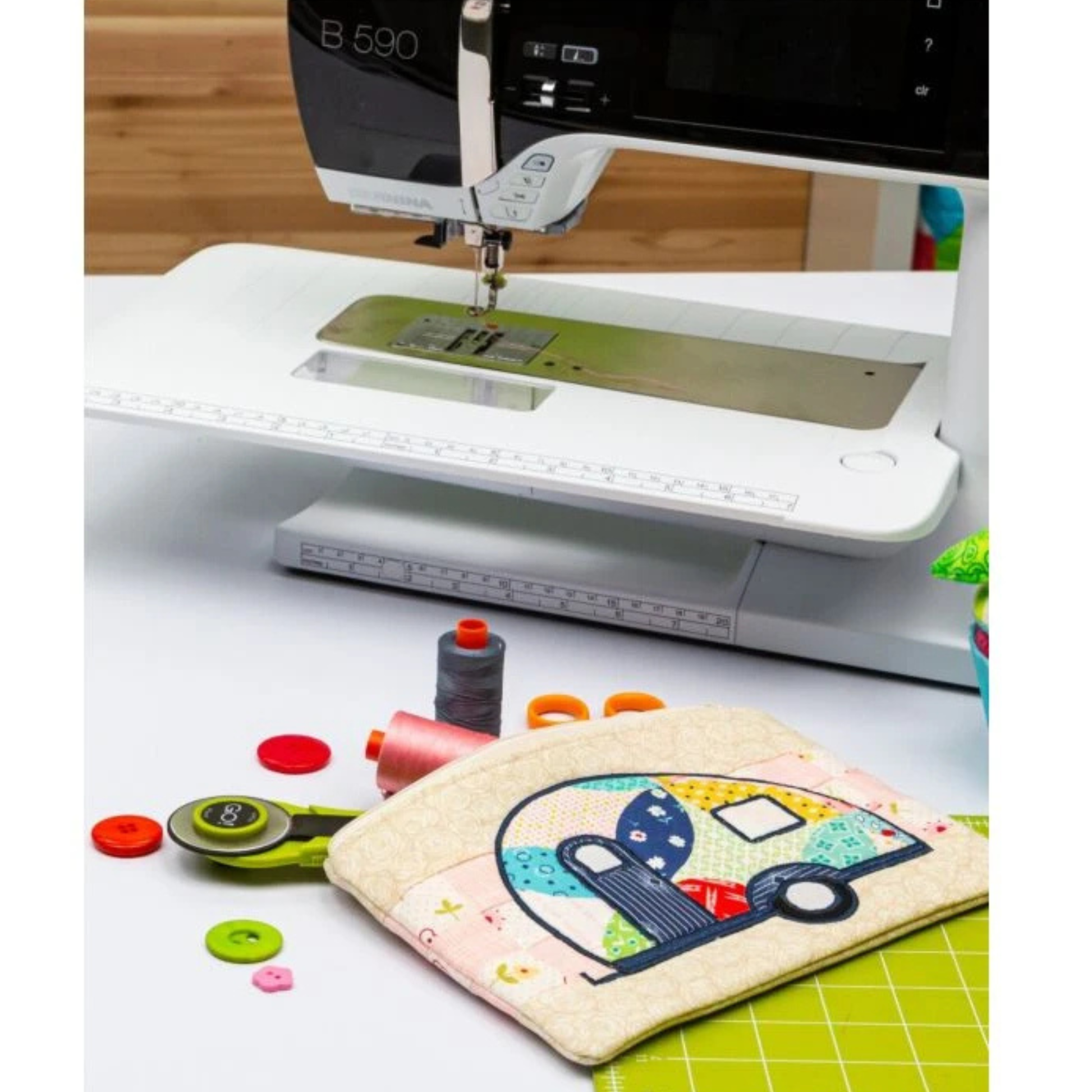 AccuQuilt GO! Camper pouch being sewn on a Bernina machine with thread and a rotary cutter