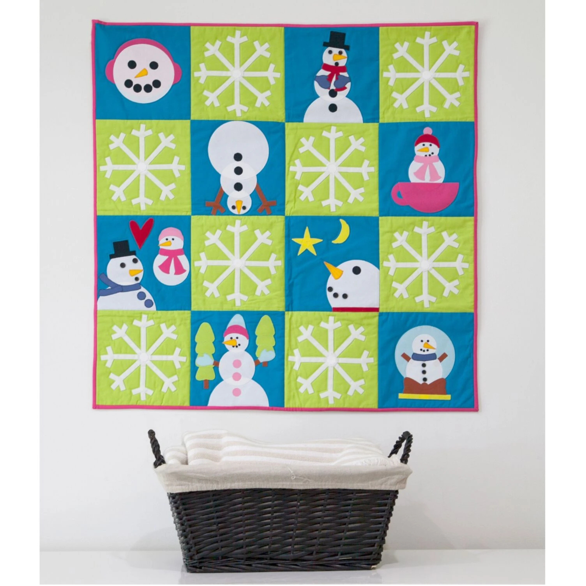 AccuQuilt GO! Holiday Accessories snowmen and snowflakes on a lime and turquoise panel quilt