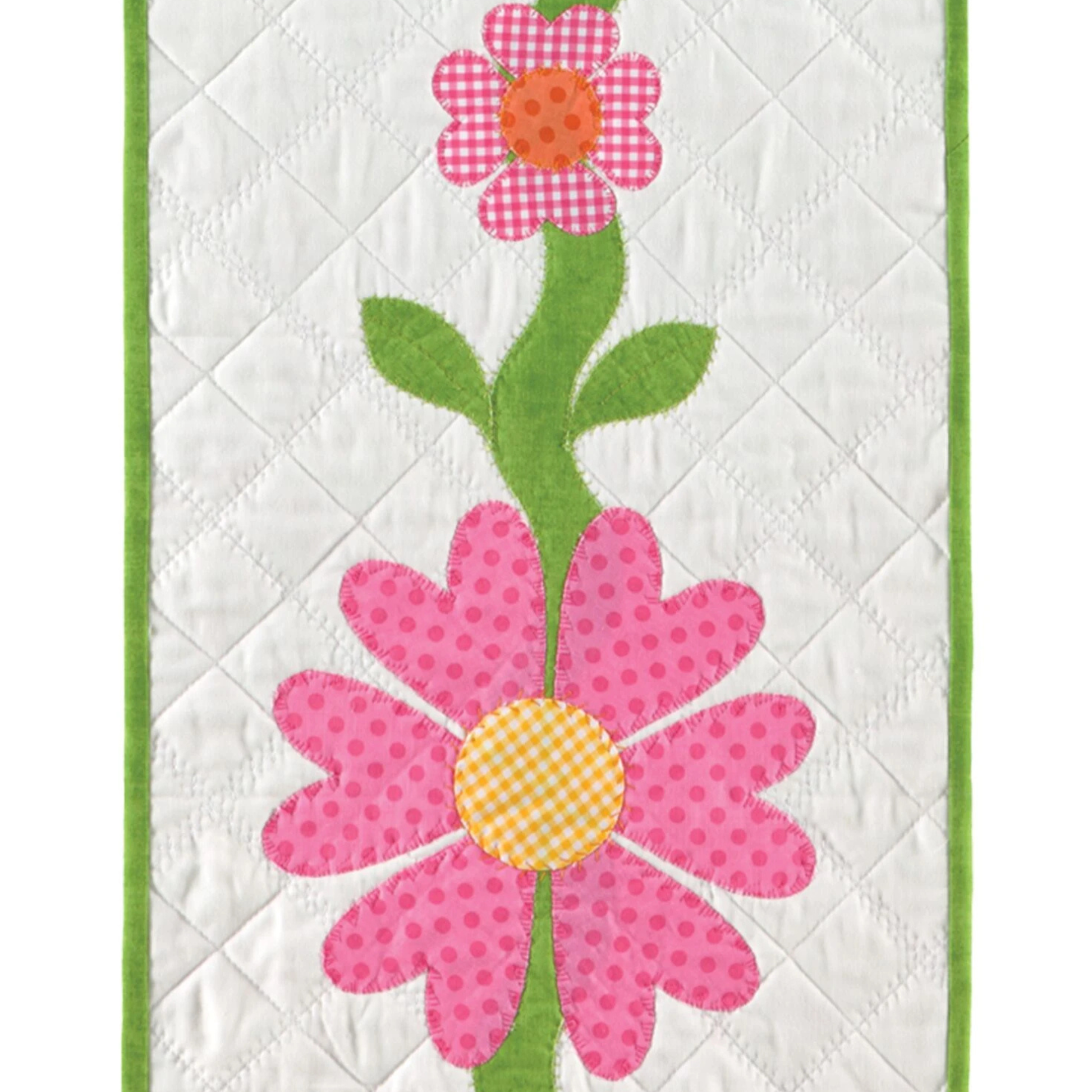 AccuQuilt GO! Queen of Hearts used as flower petals in pink gingham and dotted fabric on a runner