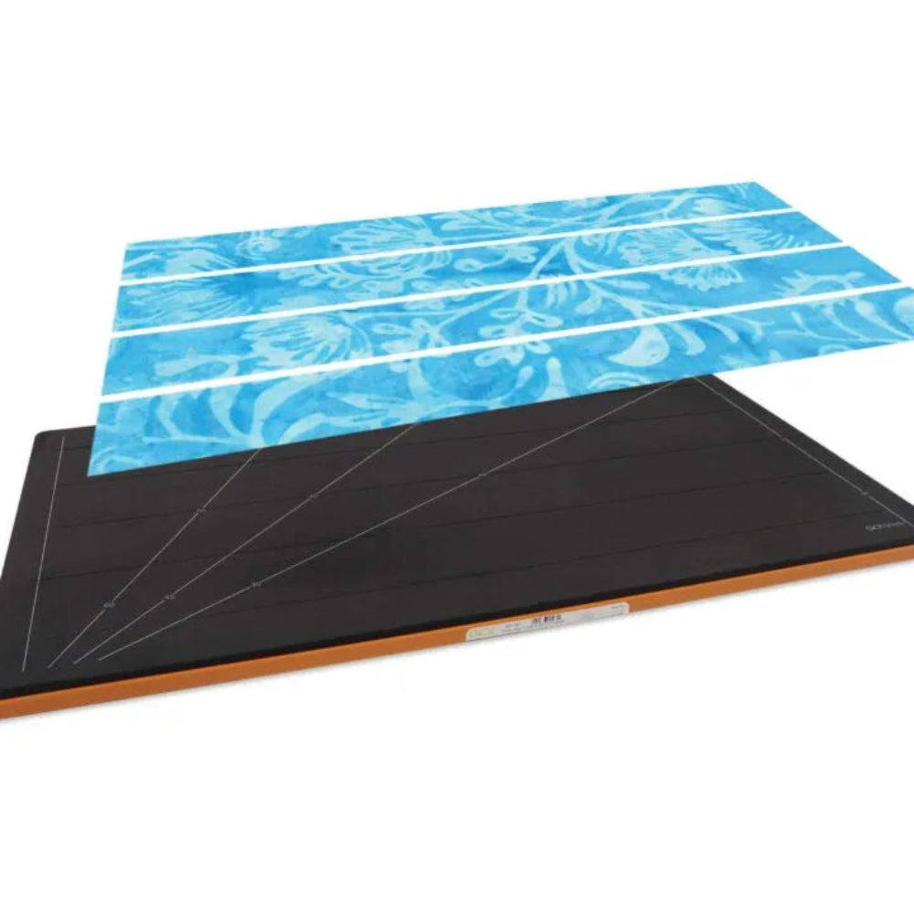 AccuQuilt GO! Grizzly Strip Cutter 2½" die shown with fabric layers