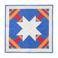 Square quilted wall hanging with a large white star, blue background and red and orange Airplane blocks
