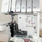 Bernina L460 overlocker close-up of looper threading area and colour-coded guides