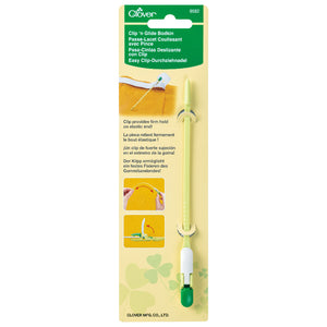 Clover Clip 'n Glide Bodkin in packaging with green clip and white handle.