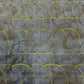 Continuous rope quilting borders in different sizes stitched in yellow thread on grey patterned fabric