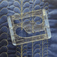 Feathers sample on blue fabric