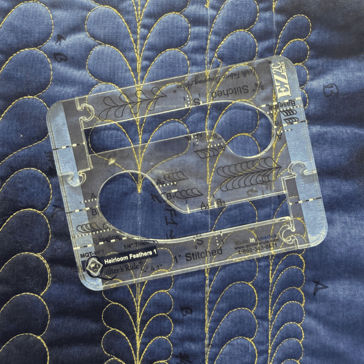 Feathers sample on blue fabric