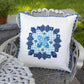 White quilted cushion cover with navy blue honeycomb EPP star medallion design and gingham border made with AccuQuilt GO! Honeycomb die
