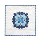 Navy and white English Paper Piecing quilt wall hanging featuring honeycomb star medallion design made with AccuQuilt GO! Honeycomb die
