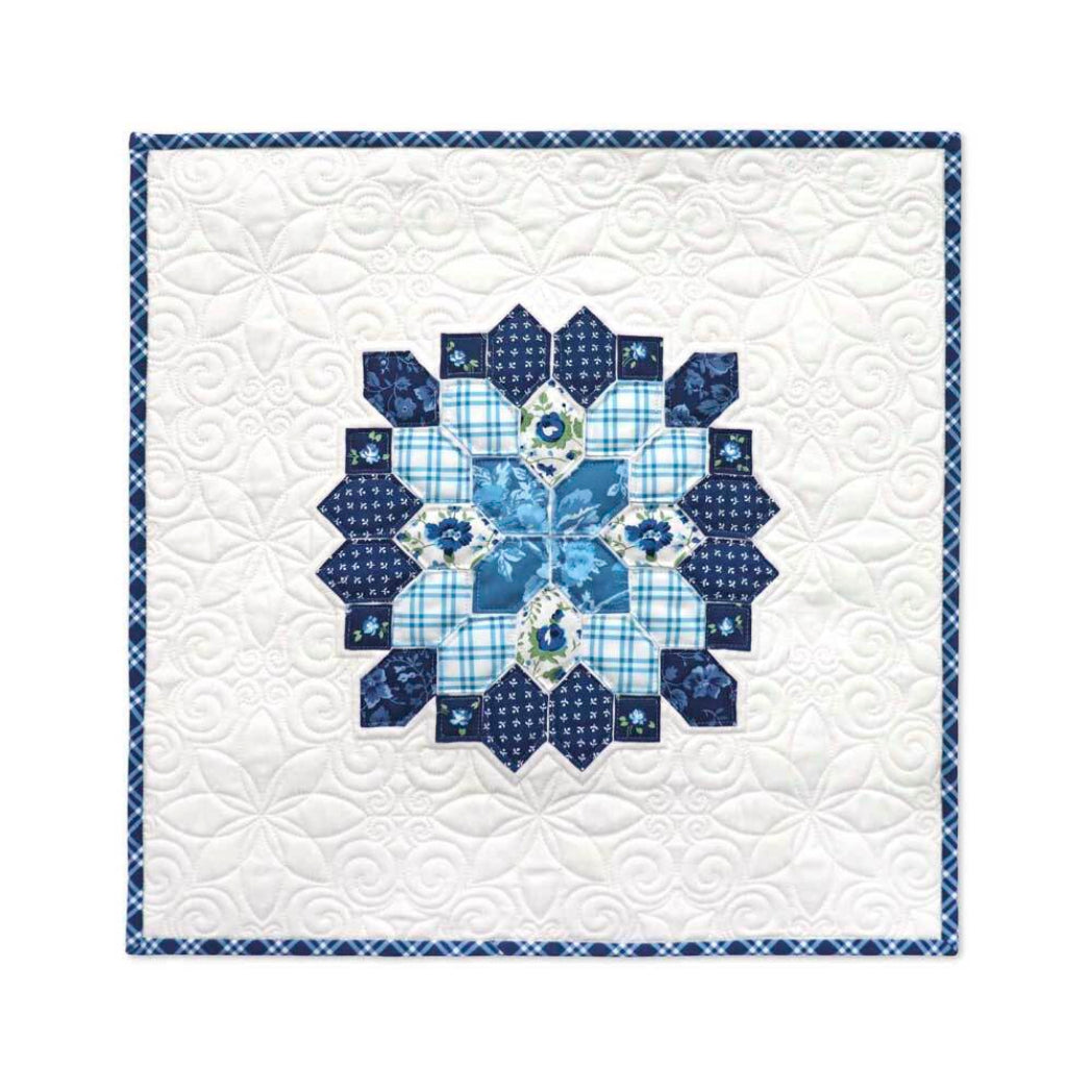 Navy and white English Paper Piecing quilt wall hanging featuring honeycomb star medallion design made with AccuQuilt GO! Honeycomb die