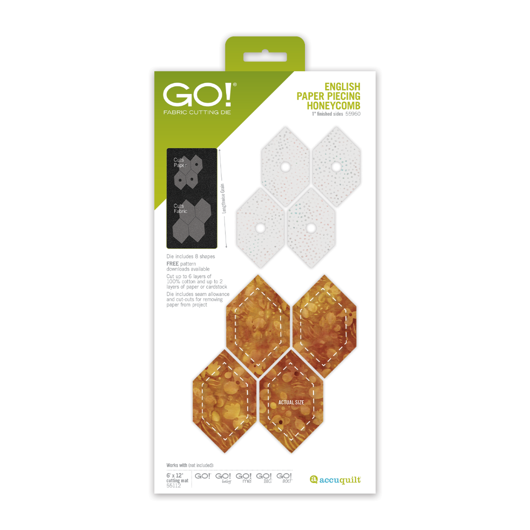 AccuQuilt GO! English Paper Piecing Honeycomb fabric cut pieces showing paper templates alongside gold batik fabric shapes with dashed seam lines on AccuQuilt Go packaging