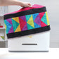 Hands sewing the June Tailor AccuQuilt GO! Big Cutter Cover Quilt-As-You-Go kit