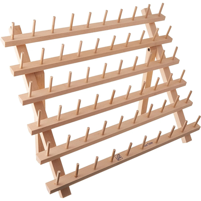 June Tailor solid wood cone thread rack with 33 spindles, shown upright on tabletop