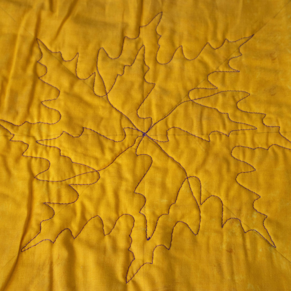 Leaf sample on gold fabric