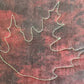 Leaf sample on black and red fabric