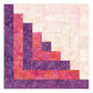 Log Cabin quilt block made with the AccuQuilt GO! 9-inch die, with nested strips of cream, pink and purple patterned fabric.