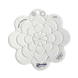 Clear plastic daisy shaped quilting template with registration marks that are easy to see. A set of nested templates lets you make four different daisy sizes, from 2 1/8 inches up to 8 5/8 inches. A non slip backing gives it a fabric gripping action.