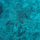 Six rounded overlapping motifs arranged in a flower-like quilting design on turquoise fabric
