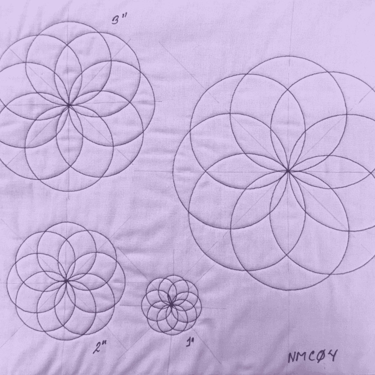 Nested mini circles sample on white fabric