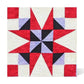 AccuQuilt GO! Nine Patch Shape Set sample quilt block with a black and lilac pinwheel centre, red star points and red corner squares on a cream background.