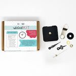 OESD Clock Kit components laid out including hands motor and metal hook