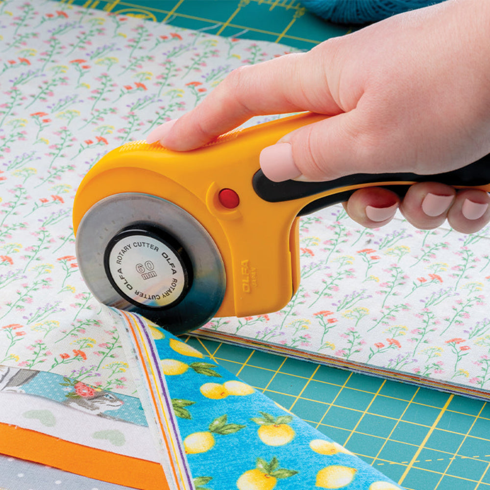 Olfa 60mm Rotary Cutter Curved Handle - Cutting  multiple fabric layers on a Self-Healing Mat