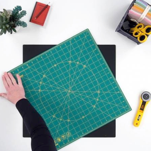 Olfa Rotating Cutting Mat showing the pivoting board in use.