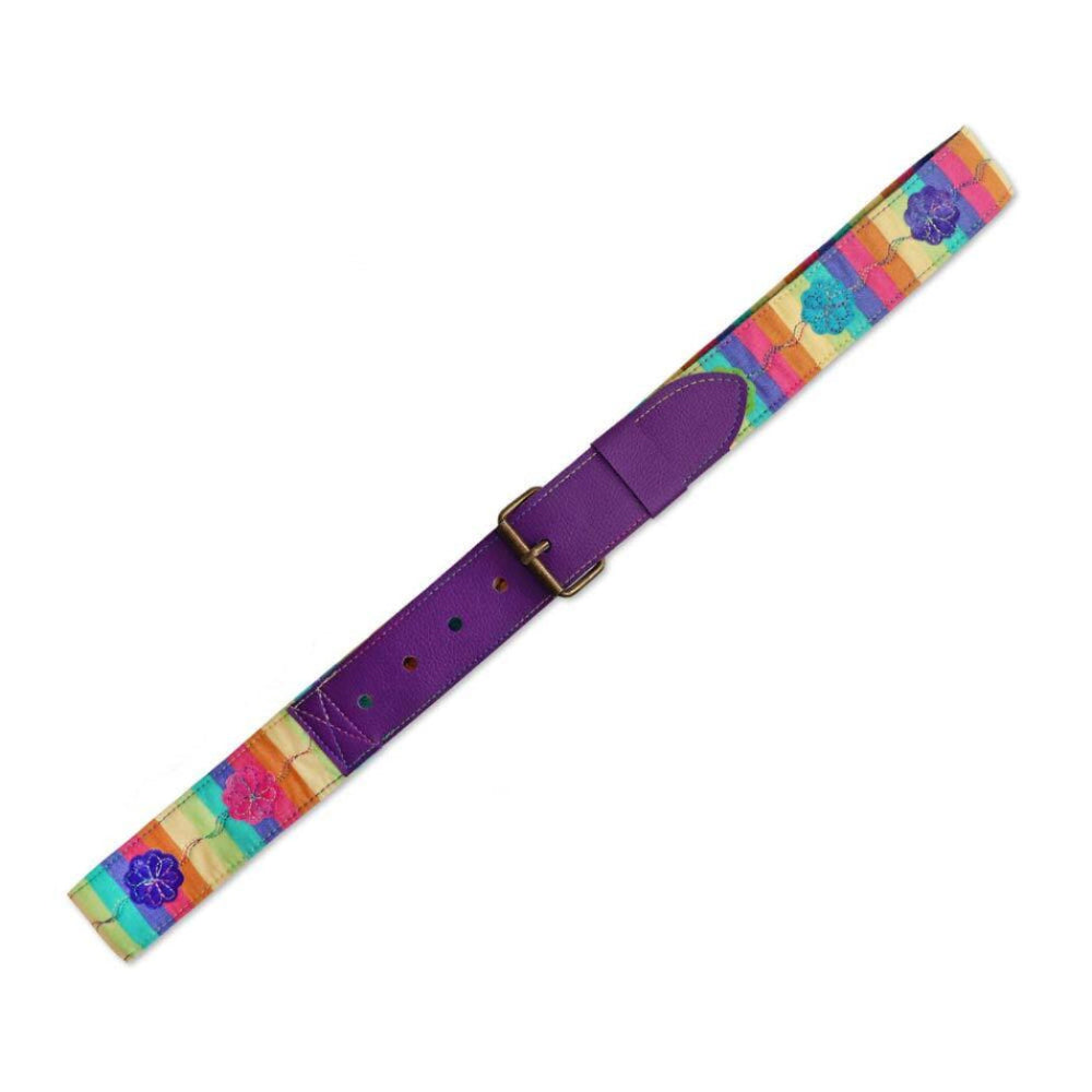 Handmade quilted fabric belt made with the AccuQuilt GO! Belt Die — rainbow striped patchwork belt with embroidered floral appliqués and purple faux leather buckle end with antique gold hardware