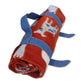 Rolled fleece blanket with dog print secured by a handmade denim fabric strap with pointed ends, created using the AccuQuilt GO! Belt Die — shown as a practical blanket carrier project