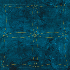 Teal fabric with gold embroidery on a white background