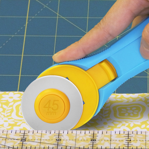 Olfa RTY-2C 45mm Rotary Cutter - Aqua Handle Showing precision grip