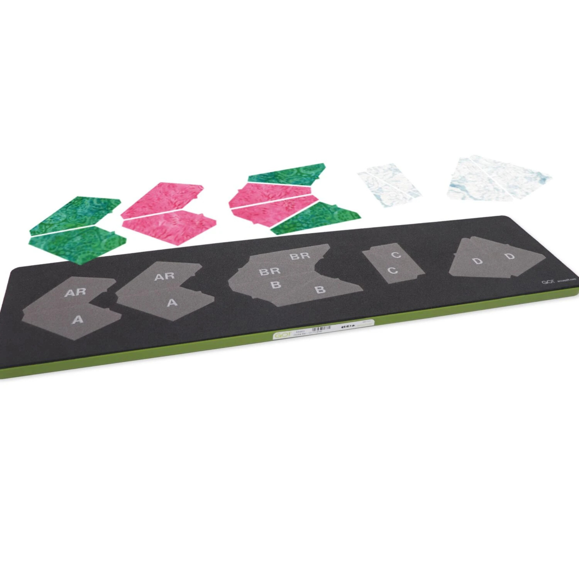 AccuQuilt GO! Double Star 10" Finished Block on Board die shown out of packaging, with screen-printed shape dies labelled A, AR, B, BR, C and D on a green-edged board, and sample cut fabric pieces in pink, green and white arranged above