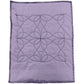 Swirl sample on purple fabric with black thread