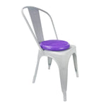 White chair with a purple cushion on a white background