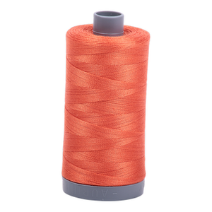 Aurifil embroidery thread spool in Dusty Orange (1154) - 28wt 750m