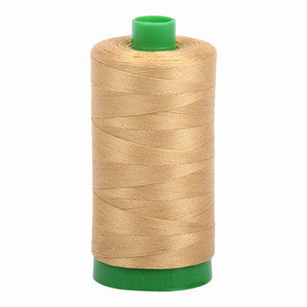Aurifil embroidery thread spool in Light Brass (2920) - 40wt 1000m