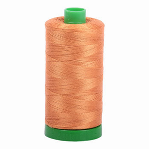 Aurifil embroidery thread spool in Medium Orange (5009) - 40wt 1000m