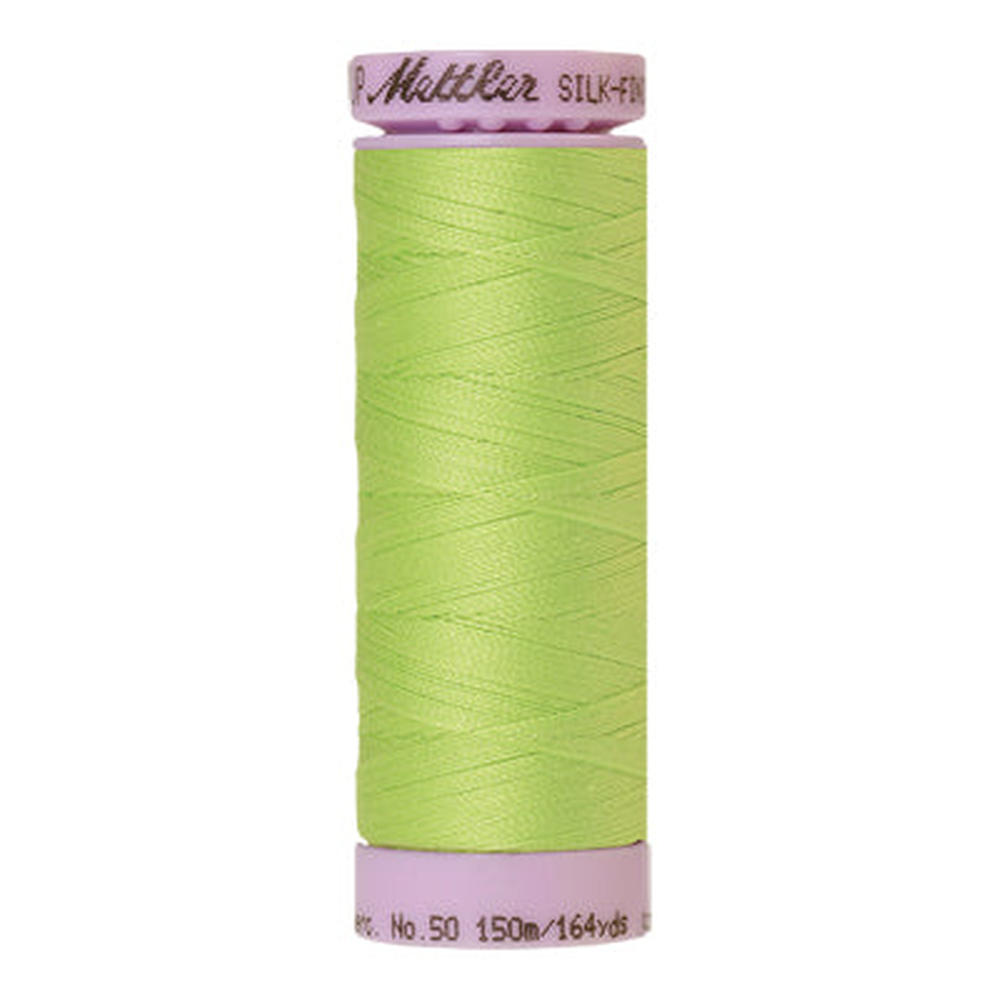 Mettler sewing thread spool in Bright Lime Green (1528) - 50wt 150m