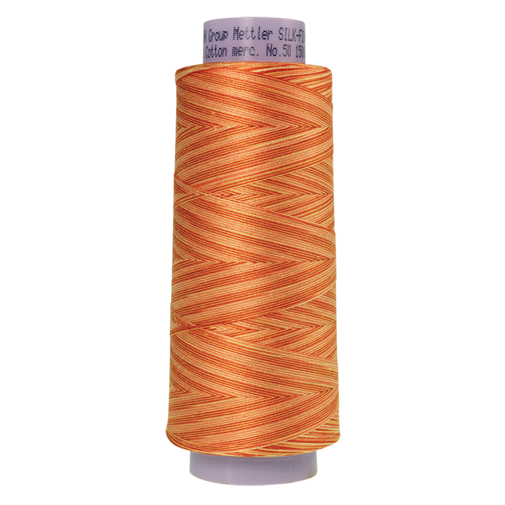 Mettler sewing thread spool in Orange Ana (9831) - 50wt 1372m